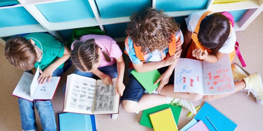 Students reading books together
